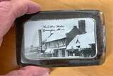["Souvenir 2.75” x 4.25” Glass Paperweight photo credit Alberto Musetti via Facebook."]
